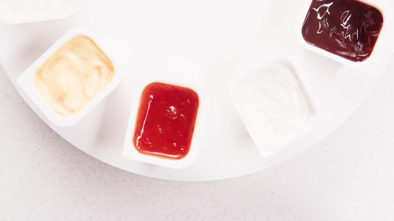 Various Dipping Sauces in Small Plastic Containers
