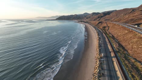 Aerial-view-of-the-Pacific-Coast-Highway-,-the-beach,-and-the-ocean