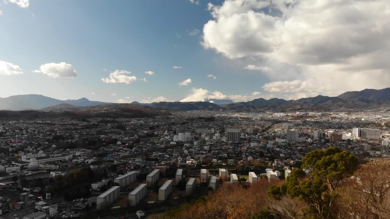Tokyo, Japan - Beautiful Scenery Of The Town Where A Distinct Snowcapped Peak Of Mt. Fuji Is Noticeable From Afar - Wide Shot