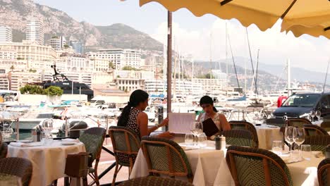 two women dining at a marina restaurant