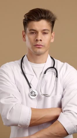 a serious male doctor in a white coat with a stethoscope