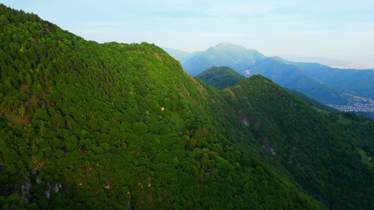 Aerial view over Selvino forest ridge with limestone outcrops and lush mountain terrain. Shot at Selvino, Italy (Selvino, Italia)