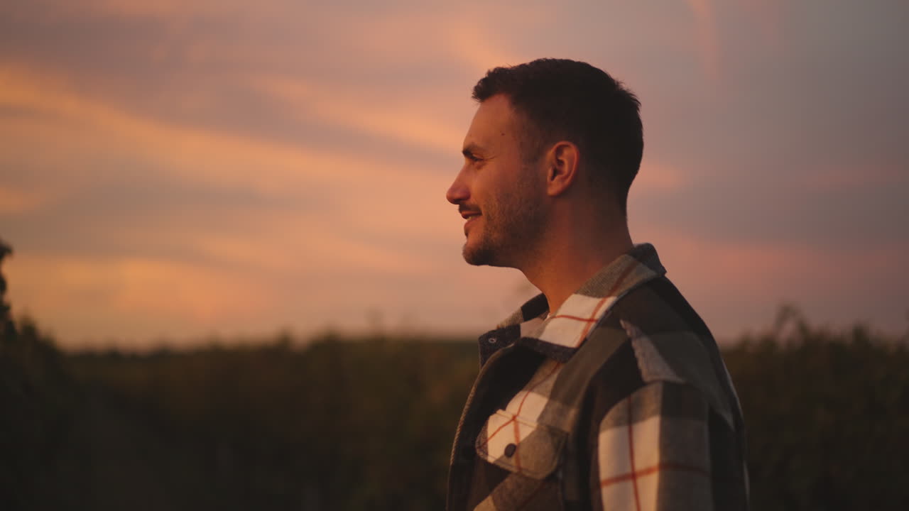 Man in Plaid Shirt at Sunset