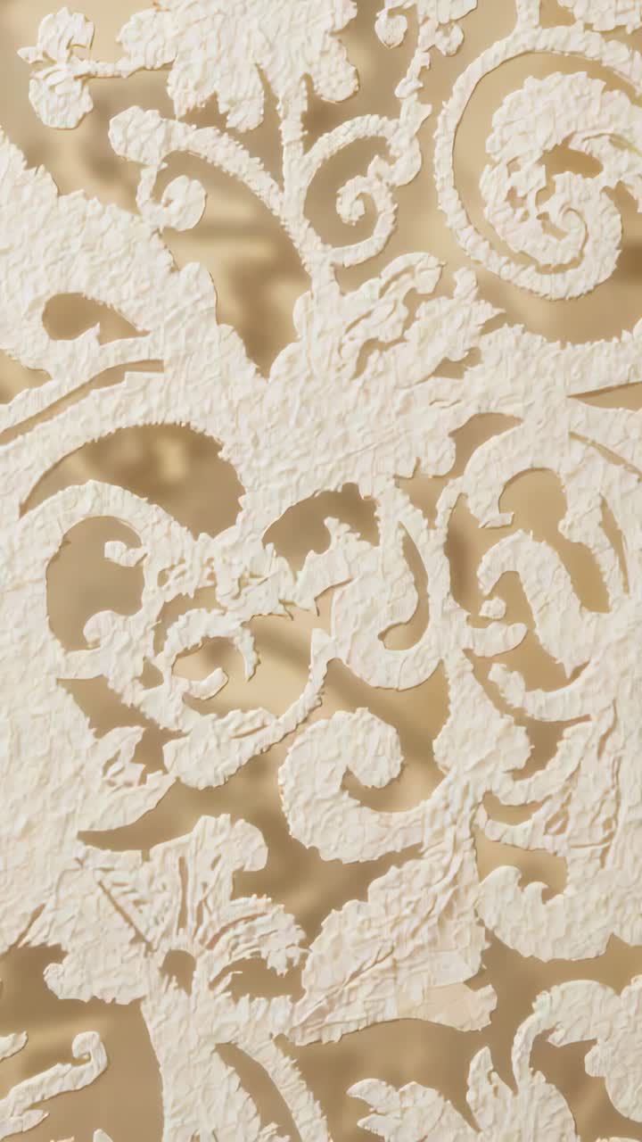 Vertical video: Panning camera revealing ornate panel on wall, showing beige backing and texture