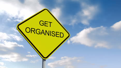 Get-organised-road-sign-over-cloudy-sky