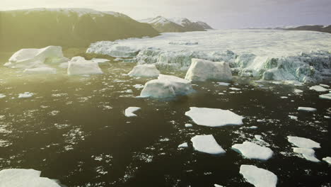 massive icebergs floating in the arctic waters during sunset hours