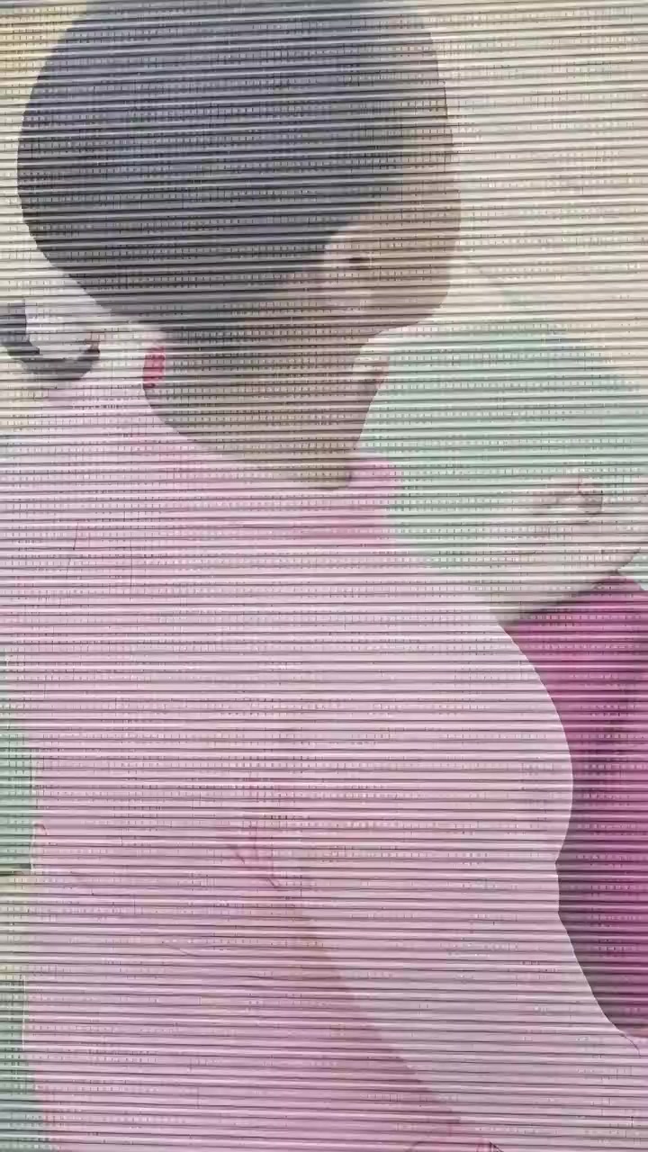 Vertical video: Class starting, child sitting on green mat, shifting hand to steady breathing