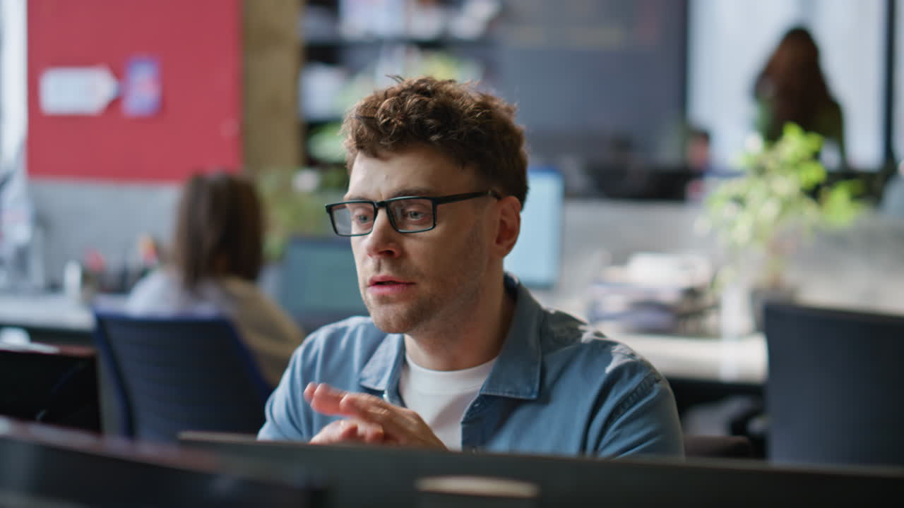 Nervous man speaking computer web conference in office room closeup. Video call
