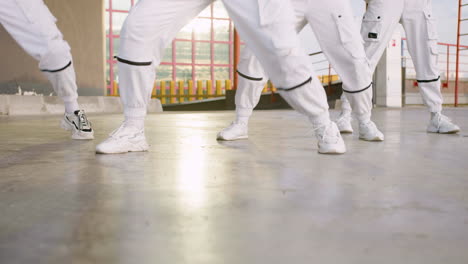 Dancers-in-white-trousers-and-socks-rehearsaling