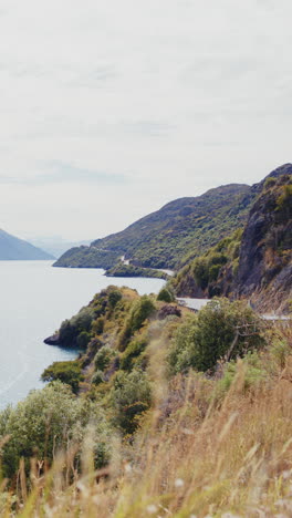 scenic mountain road by a lake