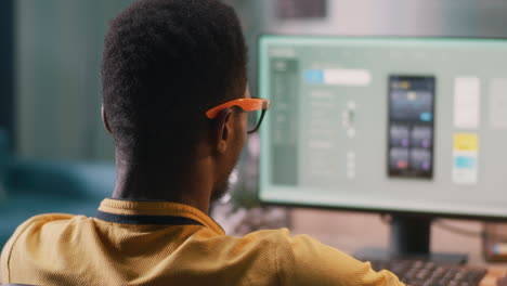man working on a computer, mobile app design