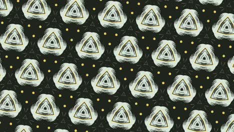 animation of white triangles arranged symmetrically in rows and rotating, on black background