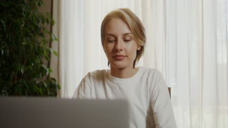 woman working on laptop at home