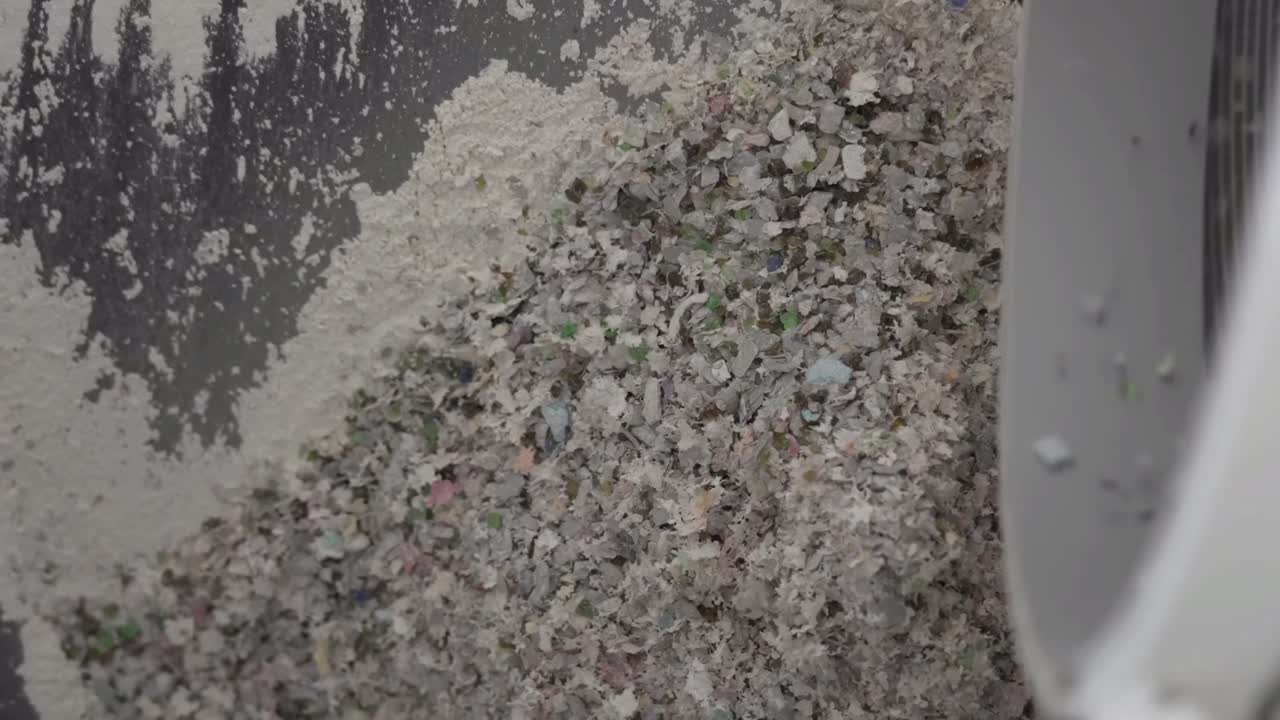The glass bottles are crushed into small pieces.