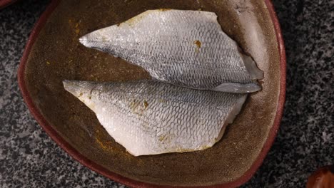 preparing sea bass fillets