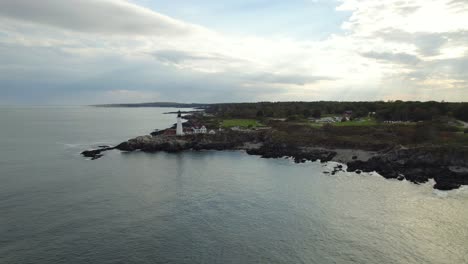 aerial afar view of portland head light lighthouse in cloudy day near ocean