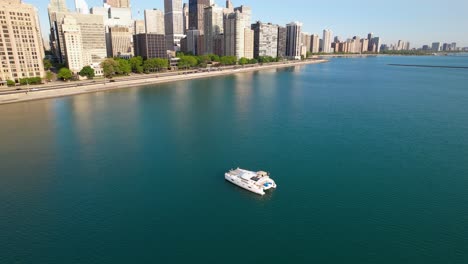 luxury yacht on blue water with city highrise skyline