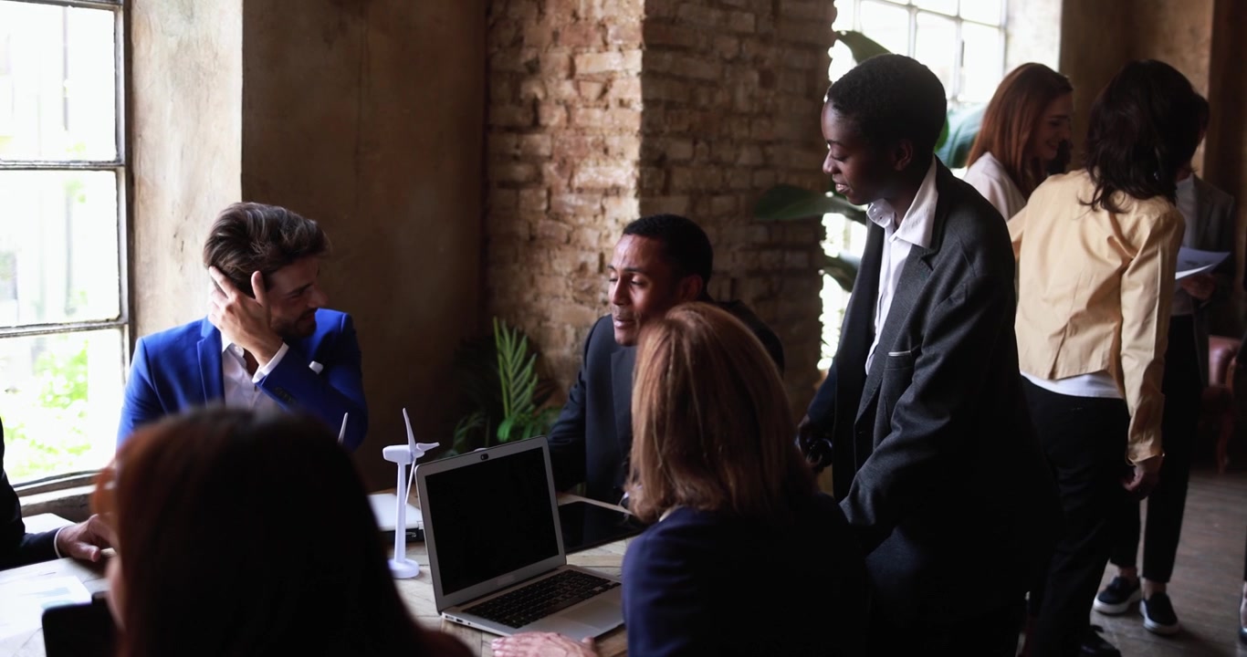 Diverse Business Team Collaborating in Modern Industrial Office