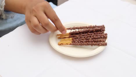 almond nut dark chocolate stick on table