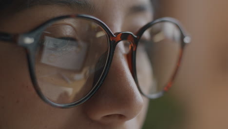 close-up of a woman wearing glasses
