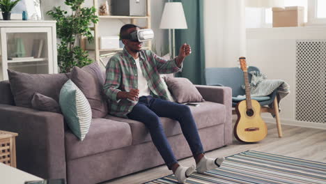 man using vr headset at home