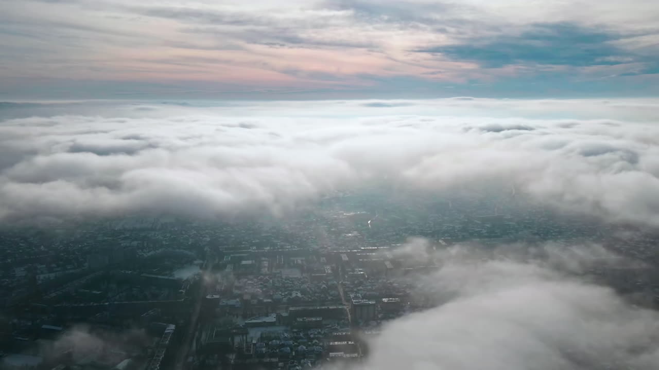 Hyperlapse of Chisinau from drone above the fast moving clouds with buildings visible through, Moldova