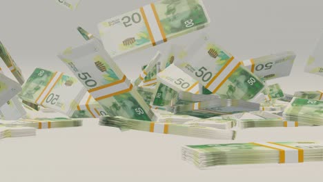 many wads of money falling on table. 50 israeli shekel banknotes. stacks of money.