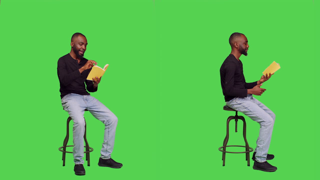Homem sentado lendo um livro em uma tela verde