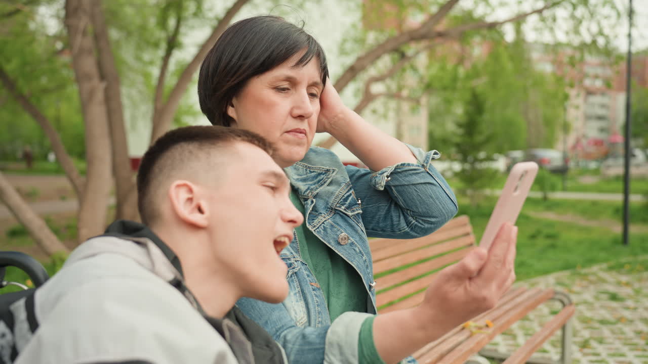 Happy Moments Captured During Parkside Bonding, Caucasian Parent And Child Sharing Joyful Selfie Outdoors Together, Cheerful Scene Of Mother And Son Laughing While Taking Pictures On Park Bench