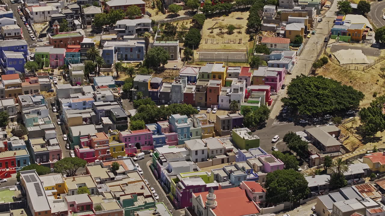 Cape Town South Africa Aerial v57 zoomed birds eye view flyover and around Bo-Kaap neighborhood, capturing vibrant streets and colorful painted buildings - Shot with Mavic 3 Pro Cine - Jan 11th 2024