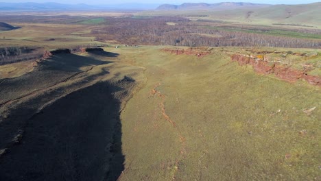 aerial view of a mountain range with a cliff