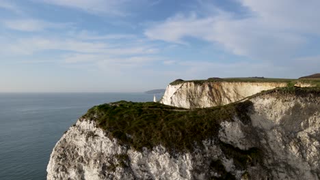 drone flying over white cliffs of old harry rocks on purbeck island in dorset