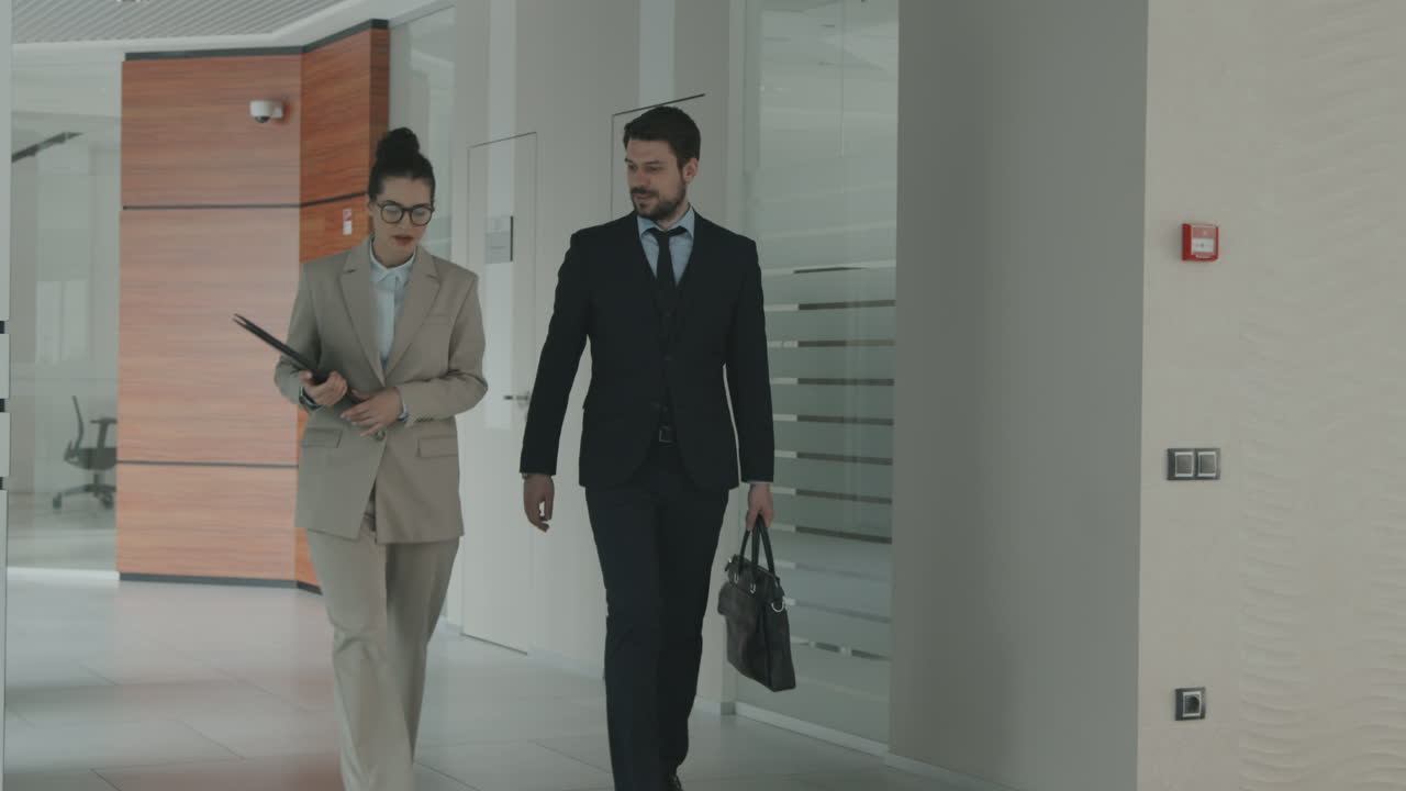 Couple of Lawyers Walking along Office