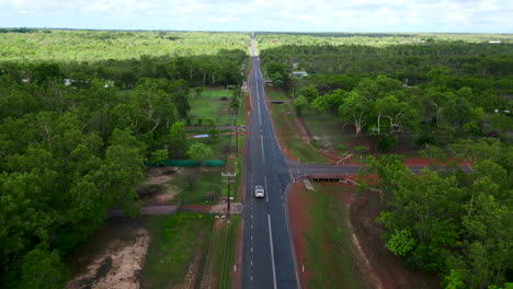 drone areal footage following a car alone a rural road