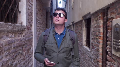 tourist walking through a venetian alley