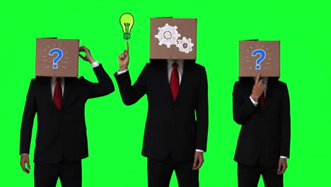 Team-of-businessman-hiding-head-with-box-