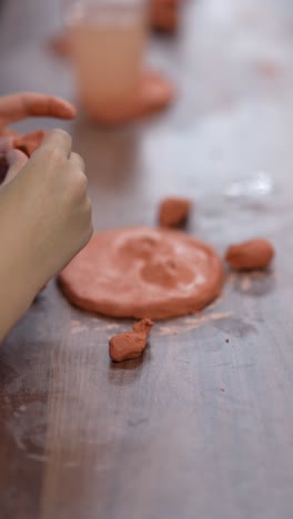 child making clay figurine