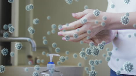 animation of covid 19 virus cells over caucasian woman washing hands