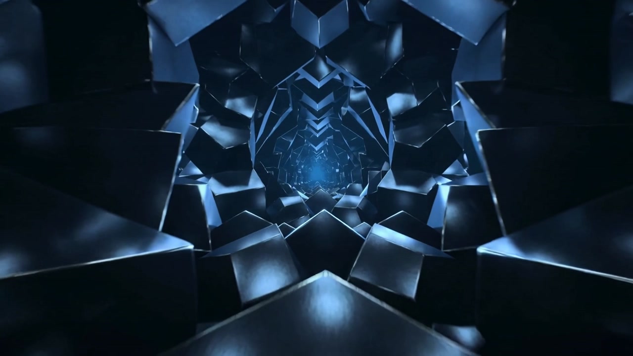 Sequence starting, camera advancing through faceted blocks tunnel, revealing glowing core