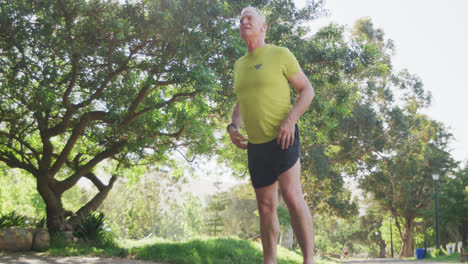 Senior-man-taking-a-break-from-running-in-the-park