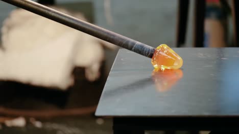 glassblower shaping a molten glass