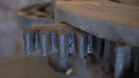 close-up of an old dirty gear in motion