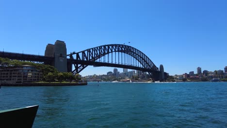 tracking shot towards sydney harbour bridge on a sunny day