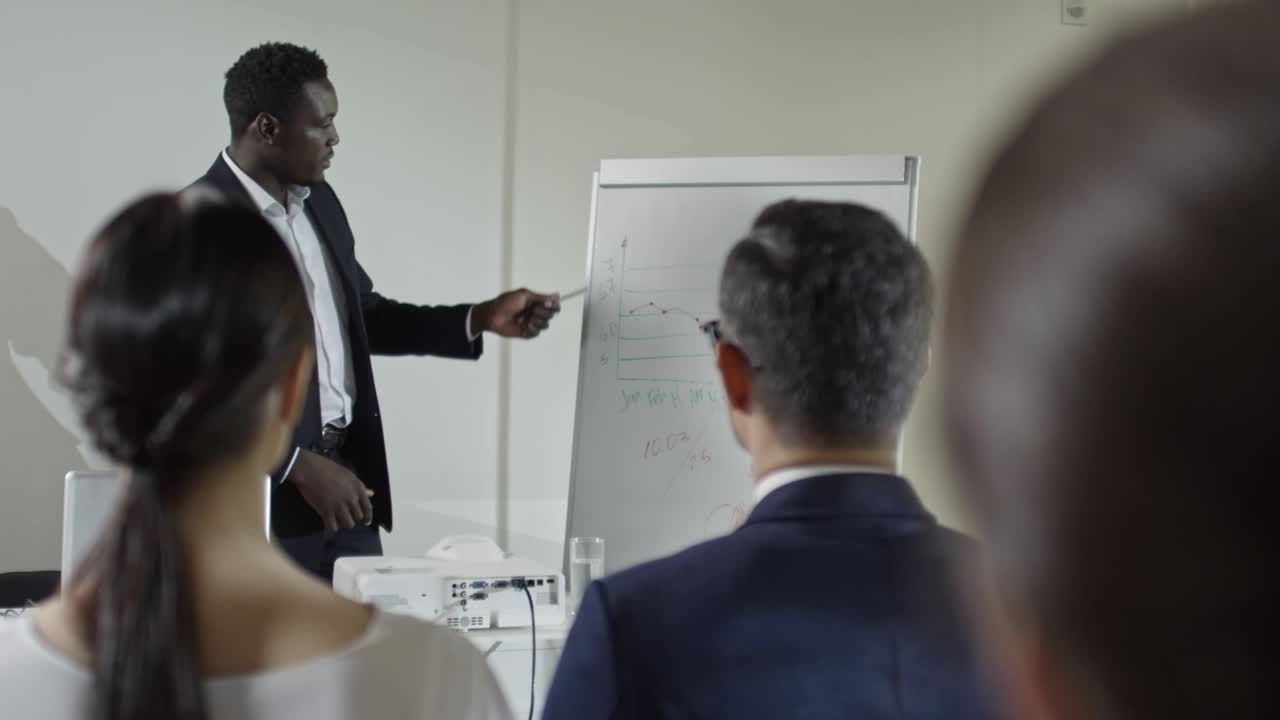 African Businessman Delivering Financial Report