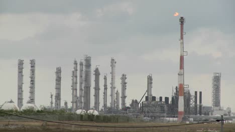 fire burns at an oil refinery 1