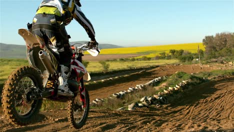 man riding a motor cross bike