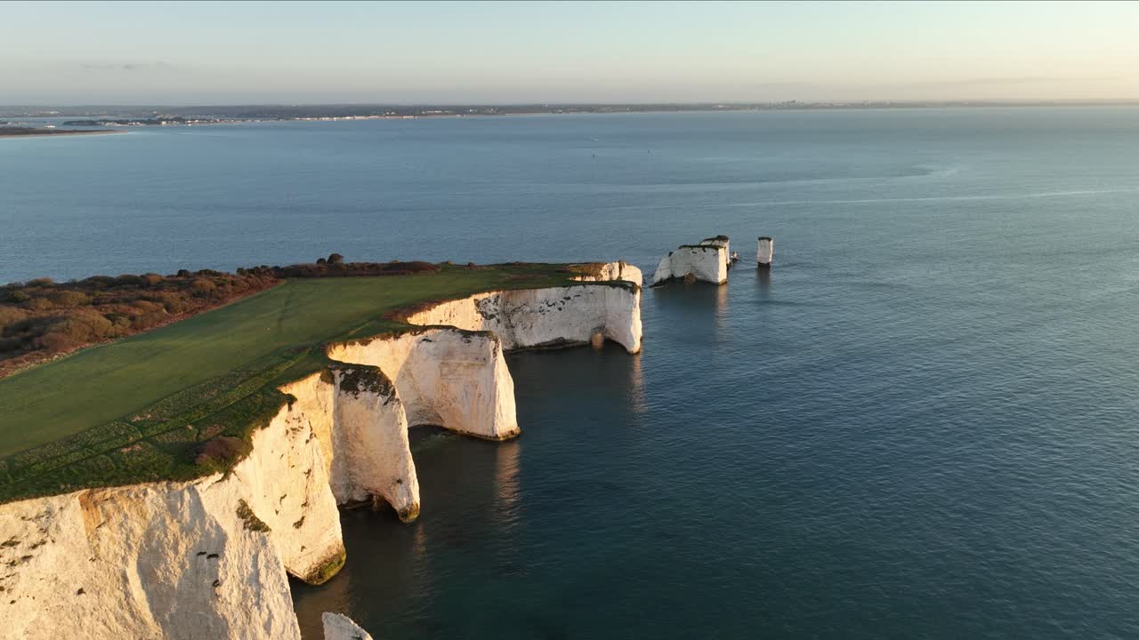 Aerial view of Old Harrys Rocks with Sandbanks and Bournemouth in the distance