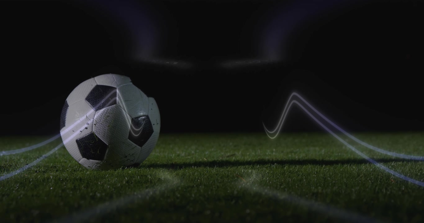 Animation af neonformer over en fodboldspiller, der sparker til bolden på et stadion.