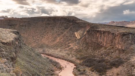 the virgin river flowing through a steep cliff gorge near la verkin, utah - zoom out reveal time lapse