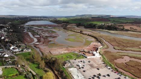 Aerial-panning-left-shot-of-the-River-Otter-Restoration-Project-works-at-Budleigh-Salterton-Devon-England